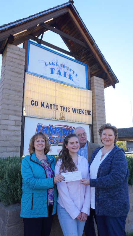 From left, Lake County Fair Chief Executive Officer Debbie Strickler; 4-H member Erica Illg, an honorary junior board member for the Lake County Fair Foundation; Bill Groody of the Lake County Wine Alliance; and Lake County Fair Foundation Board President Ruth Stewart at the fairgrounds in Lakeport, Calif., on Monday, February 8, 2016. The group is shown with a check for $10,000 from Lake County Wine Alliance/Lake County Rising. Photo by Elizabeth Larson/Lake County News. 020816lcffboardpic
