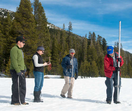 Officials with the California Department of Water Resources conduct a manual snow survey east of Sacramento on Tuesday, March 1, 2016. Photo courtesy of the California Department of Water Resources. 030116snowsurvey