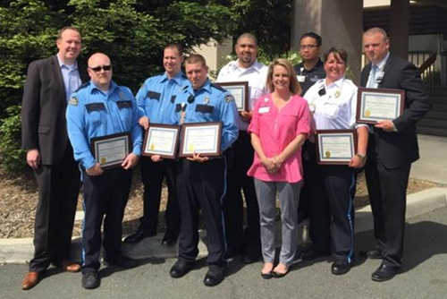 From left to right, AlliedBarton VP of Operations for Northwest Region Kelly Murcray; Officers Matthew Holt, Arsen Barbeau and William Stiles; Site Supervisor Daniel Dudley; JLL Regional Facility Director Laurie Anseth; JLL Facility Director for St. Helena Hospital Center for Behavioral Health Benedict Villa; Site Supervisor Tiffany Piehler; and AlliedBarton Account Manager Eric Casner celebrate the team’s service. Courtesy photo. 040816shhclsecurityawards