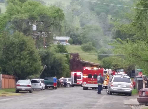 Firefighters at the scene of a house fire in Lucerne, Calif., on Sunday, April 10, 2016. Photo by Elizabeth Larson/Lake County News. 041016lucernehousefire