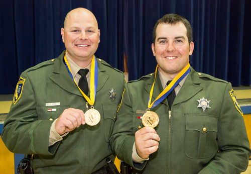 From left, California Department of Fish and Wildlife officers Timothy Little and Ryan Stephenson with their Medal of Valor awards, which they received on Tuesday, April 12, 2016, in Sacramento, Calif. Photo courtesy of the California Department of Fish and Wildlife. 041216cdfwofficersvalor