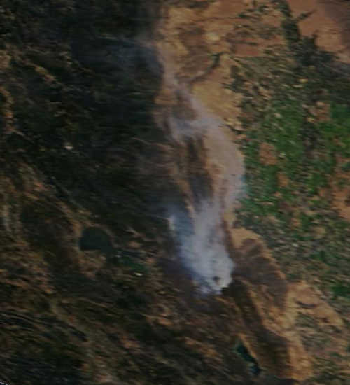 A NASA satellite photo shows the Jerusalem fire's plume of smoke east of Clear Lake in Lake County, Calif. The smoke plume has drifted north over the Rocky fire area, resulting in calls to 911, according to radio traffic. 081215jerusalemfiresatellite