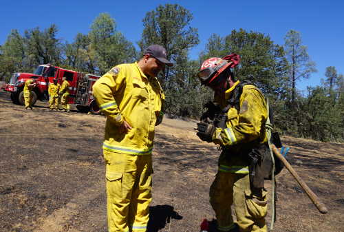 Cal Fire Capt. Sean Jerry, left, speaks with a firefighter who walked the perimeter of the Peterson fire near Kelseyville, Calif., on Monday, August 24, 2015. Photo by Elizabeth Larson/Lake County News. 082415petersonfirejerry