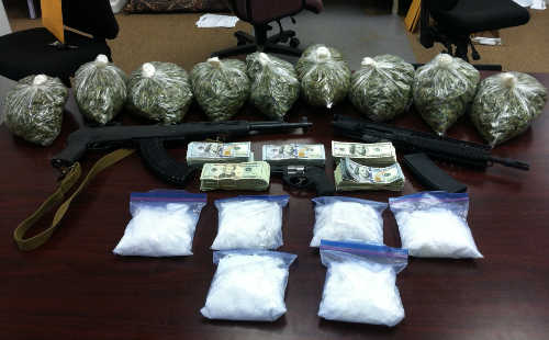 Lake County Sheriff’s Narcotics Task Force detectives seized marijuana, methamphetamine, weapons and US currency during a search warrant service on Tuesday, August 25, 2015. Photo courtesy of the Lake County Sheriff's Office. 082515potbustguns