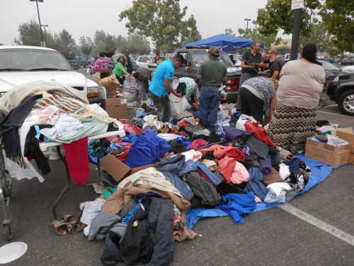 Donations for Valley Fire evacuees are being collected at several sites in the parking lot at Clearlake, Calif., Walmart. Walmart is keeping its door open 24 hours to ensure evacuees have a place to go and the supplies they need. Photo by Denise Rockenstein/Lake County News. 091415valleyevacsclothes
