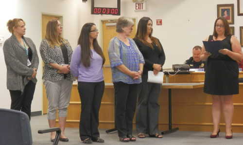 Lake Family Resource Center representatives Kimberly Layton (left), Gina Pilat, Amber Westphal, Gloria Flaherty and Sheri Young accept a proclamation from Clearlake Vice Mayor Gina Fortino Dickson declaring October "Domestic Violence Awareness Month" in the city. The proclamation was presented before the city council on Thursday, October 8, 2015. Photo by Denise Rockenstein/Lake County News. 100615dvproclamation