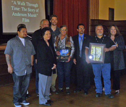 Shown at the 30th annual Governor’s Historic Preservation Awards in Sacramento, Calif., on Thursday, November 19, 2015, were – left to right – front row, Rob Morgan and Judy Morgan of the Koi Tribe; Leslie Steidl and Eddie Guaracha of California State Parks; Koi Tribal Executive Director Dino Beltran; and State Historic Preservation Officer Julianne Polanco; back row, archaeologist Dr. John Parker; and Dan Bruns of Chico Advanced Laboratory for Visual Anthropology. Photo courtesy of Dr. John Parker. 111915govfilmawardgroup