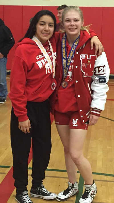 Upper Lake High School wrestlers Adriana Lopez, left, placed third in the 106-pound division and Christina Wilson won the championship in the 121-pound class at the Girls North Coast Section Wrestling Tournament on Friday, February 12, and Saturday, February 13, 2016, in Albany, Calif. Wilson is the first female Upper Lake High wrestler to place first at the competition. Photo courtesy of Denae Maddock. 2015cifsectionswilsonandlopez