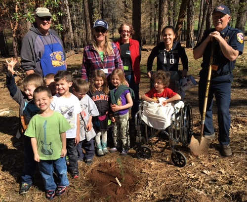 Children and adults partner for a garden planting project near Middletown, Calif. Photo courtesy of the Fire Family Foundation. 2016mtowngardenkids2