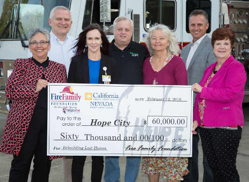 The Fire Family Foundation and California credit unions presented a $60,000 donation to Hope City, a disaster relief agency rebuilding homes following the Lake County, Calif., fires. Pictured front row (left to right): Diana Dykstra, president/CEO, Nevada/California Credit Union League; Shelly Mascari, executive chair, Team Lake County; Patty Bruder, executive director, North Coast Opportunities; and Robin McCarthy, executive director, Fire Family Foundation. Back row (left to right): Richard Cooper, president/CEO, Mendo-Lake Credit Union; Kevin Cox, president/CEO, Hope Crisis Network/Hope City; and Brett Martinez, president and CEO/Redwood Credit Union. Courtesy photo. hopecitycheckpresentation1