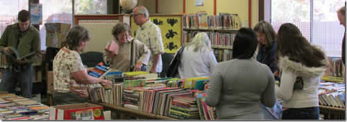 Library patrons enjoy selecting new reads at a Friends of the Library book sale in Lakeport, Calif. lakeportlibrarybooksale