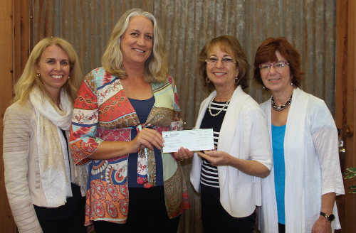 Homestake Mining Co. (Barrick Gold Corp.) donated $5,000 to #LakeCountyRising. In this photo: Debra Sommerfield, Lake County Winegrape Commission; Peggie King, Homestake Mining Company; Sharron Zoller, Lake County Wine Alliance; and Terry Dereniuk, Lake County Winery Association. Courtesy photo. lcrisinghomestakegroup