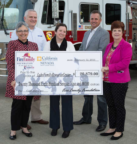 The Fire Family Foundation and California credit unions presented a donation of more than $20,000 to Lake Family Resource Center to assist with childcare needs following the Lake County fires. Pictured front row (left to right): Diana Dykstra, president/CEO, Nevada/California Credit Union League; Jennifer Dodd, executive director, Lake Family Resource Center; and Robin McCarthy, executive director, Fire Family Foundation. Back row (left to right): Richard Cooper, president/CEO, Mendo-Lake Credit Union; and Brett Martinez, president and CEO/Redwood Credit Union. Courtesy photo. lfrccheckpresentation