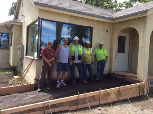 Cement preparation for the Americans with Disabilities Act-compliant walkway is being done by volunteers including, from left to right, Kris Langdon and Rodney Silva with city of Clearlake workers Clay Van Housen, Jose Mendoza and Dean Lain. Photo by Susanne Scholz. may2016clearlakevisitorctr