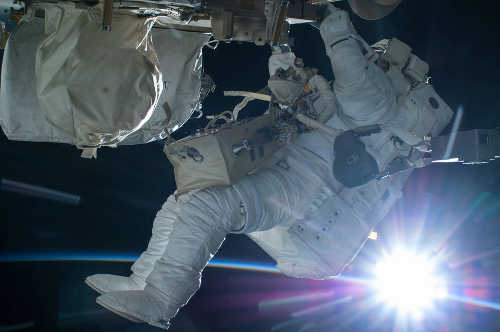 Astronaut Terry Virts conducts a spacewalk during an orbital sunrise on Feb. 21, 2015. Credits: NASA. nasaspacewalk