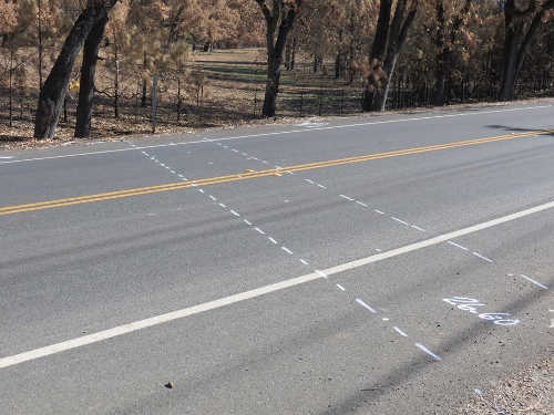 An area on Highway 175 near Middletown, Calif., where marks have been placed to denote where the cement will need to be cut in order to repair a culvert damaged by the Valley fire. Photo courtesy of Caltrans. oct2015caltransculvert