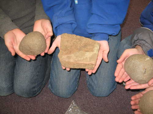 Miwok hand stones discovered near Middletown, Calif. The artifacts are determined by archaeologists to be more than 7,000 years old. Photo by Kathleen Scavone. scavonehandstones