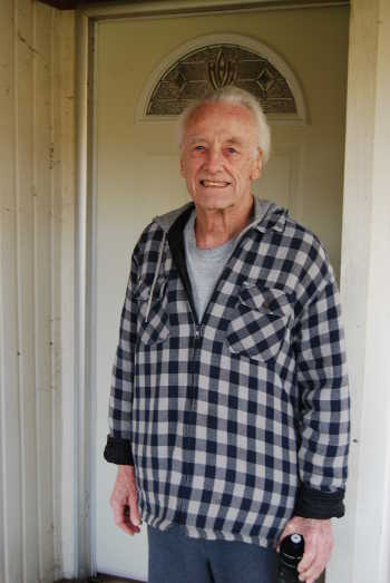 Navy veteran James Evans standing in front of the new door Habitat for Humanity Lake County installed at his home in Clearlake Oaks, Calif. Photo courtesy of Habitat for Humanity. vetjamesevans
