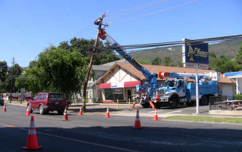 A Pacific Gas and Electric crew works on pole repairs following a vehicle crash in Lucerne, Calif., on Wednesday, June 29, 2016. Photo by John Jensen/Lake County News. 062916lucernepolecrash