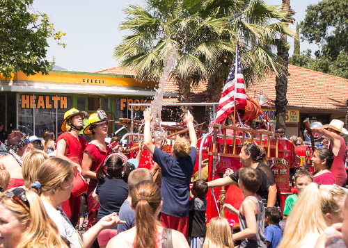 Lake County Fire Protection District's firefighters and their classic fire truck were a favorite entry in the Redbud Parade on Saturday, July 2, 2016, in Clearlake, Calif. Photo by Kurt Jensen/Lake County News. 070216jensenfiretruck