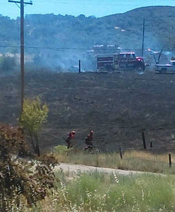 Firefighters work at the scene of a fire on Tuesday, July 12, 2016, in Lakeport, Calif. Photo by Krystal Ashby. 071216ashbylakeportfire
