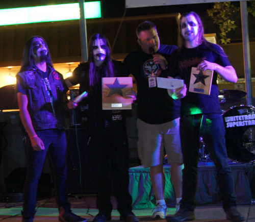 Fog Realm – shown here with event emcee Martin Scheel – won third place and was named 94.5 Kwine Metal Artists at the Rising Stars Music Competition in Ukiah, Calif., on Saturday, September 17, 2016. Photo by Mary Chadwick. 091716risingstarsfogrealm