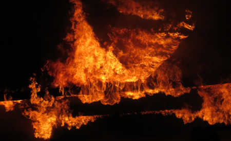 Fire engulfs the roof of an auto repair shop in Kelseyville, Calif., late on Monday, September 19, 2016. Photo by Rob Grant. 091916mikesautofiregrant2