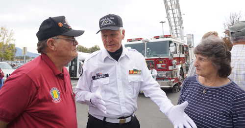 From left, Dean Gotham, guest speaker at the Lake County Veterans Day celebration on Friday, November 11, 2016, in Lakeport, Calif., speaks after the ceremony with Capt. Herman “Woody” Hughes (ret.), a fellow Vietnam veteran, about the weeklong Battle of Dai Do Valley – a battle that took place from April 29 to May 15, 1968, in which both men fought – as Hughes' wife Sandy looks on. Photo by Elizabeth Larson/Lake County News. 111116vetsdaygothamhughes