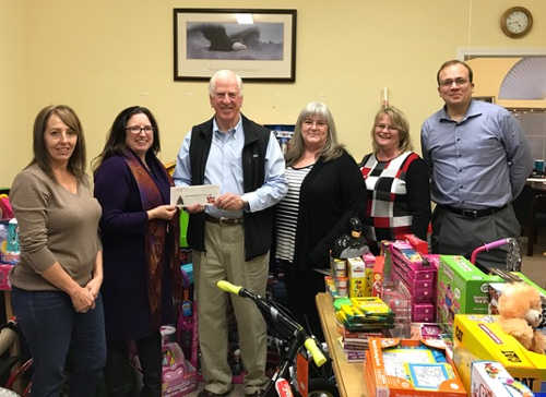 Congressman Mike Thompson and staff with Lake Family Resource Center in Lake County, Calif., on Wednesday, December 14, 2016. Courtesy photo. 121416lfrcthompsoncheck