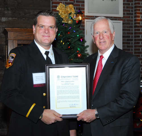 At left, Cal Fire Battalion Chief Michael Wink receives a Congressional Record Statement honoring his contributions in protecting Lake County, Calif., from Congressman Mike Thompson on Saturday, December 17, 2016, in Vallejo, Calif., at a ceremony recognizing the California Fifth Congressional District's 2016 Public Safety Heroes of the Year. Photo courtesy of the office of Congressman Mike Thompson. 121716winkthompsonaward