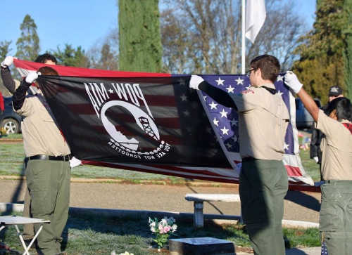 Boy Scouts Troop 42 raise the colors during the Wreaths Across America ceremony at Hartley Cemetery in Lakeport, Calif., on Saturday, December 17, 2016. Photo courtesy of Ginny Craven. 121716wreathsflags