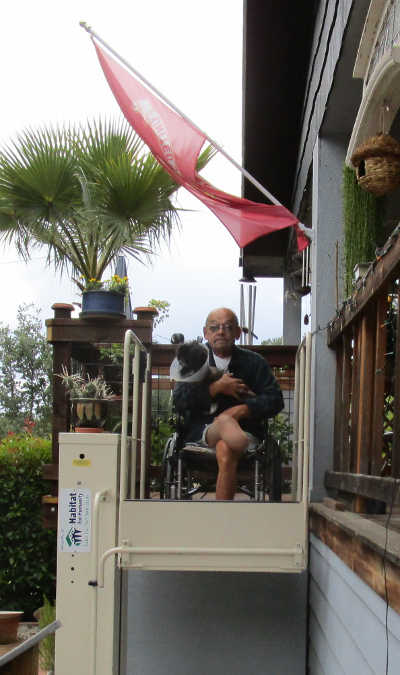 Veteran Adam Scherer on his new wheelchair lift, which he received through Habitat for Humanity Lake County's Veteran's Repair Program. Courtesy photo. adamscherervetrepairs