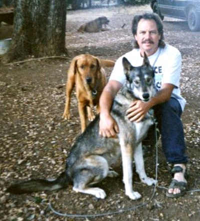 Ben Cox-Frankenfield and his wolf-dog hybrid “Girl” sometime in the 1990s. Courtesy photo. bigreadwolfgirl