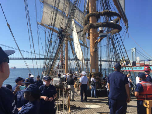 Crew and guests aboard the USCGC Eagle as they approached the Verrazano-Narrows Bridge en route to Manhattan Island. Justin Hingston’s various duties from polishing brass to working the complex rigging gave him real-life maritime and leadership experience aboard a military vessel. Photo by Justin Hingston. seascoutsuscgconboard